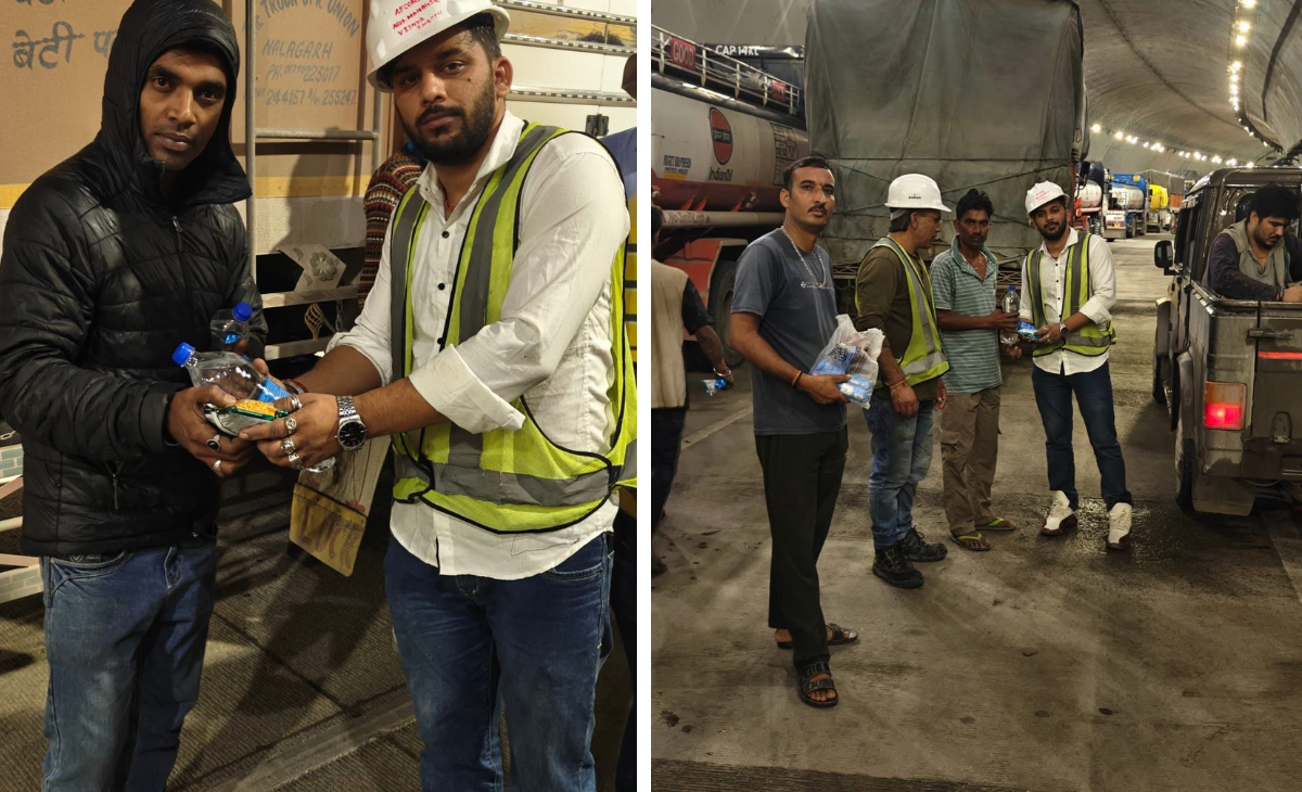 Four-lane company Afcons Infra employees deliver relief at midnight to hundreds of travellers stranded due to rain in Himachal