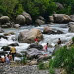 Tourists Risk Lives Bathing in Manjhi Khad Amid Monsoon Flood Threat
